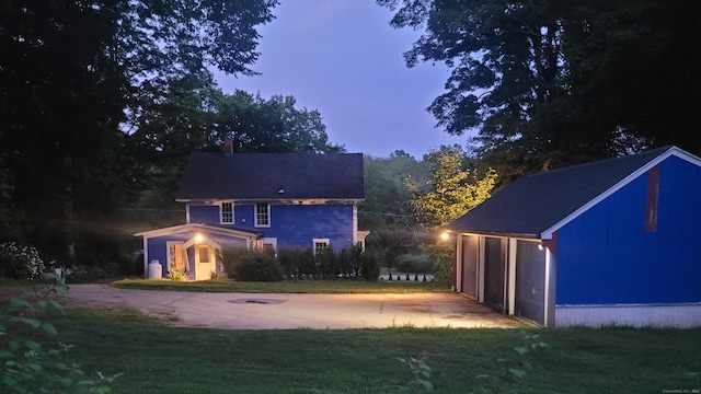 39 Windham Center Rd, Windham, CT 06280 - back of house with driveway, a lawn, and an outbuilding