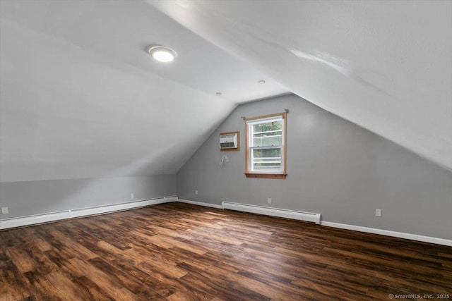 29 Pembroke Rd, Hamden, CT 06514 - additional living space with a baseboard heating unit, wood finished floors, lofted ceiling, and a wall mounted air conditioner
