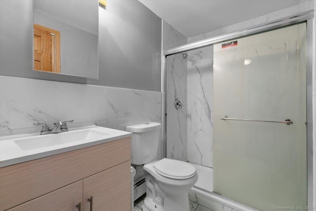 29 Pembroke Rd, Hamden, CT 06514 - bathroom featuring vanity, tile walls, a marble finish shower, a wainscoted wall, and marble look tiles