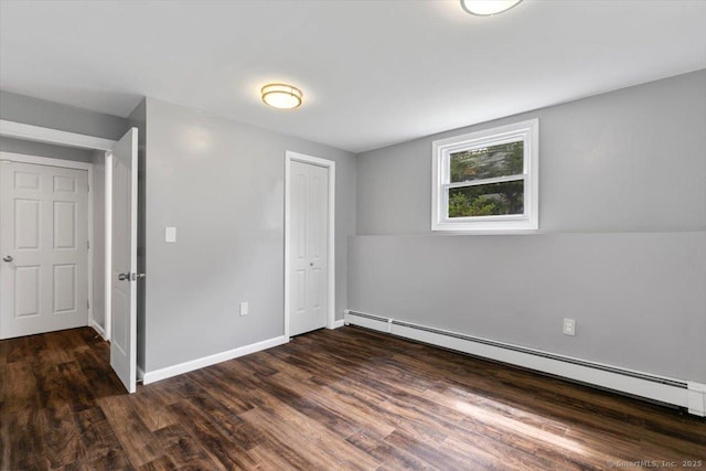 29 Pembroke Rd, Hamden, CT 06514 - unfurnished bedroom with a baseboard heating unit, wood finished floors, and a closet