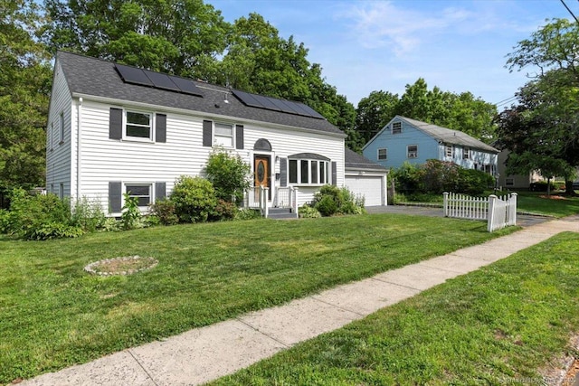 29 Pembroke Rd, Hamden, CT 06514 - view of front of house with roof mounted solar panels and a garage