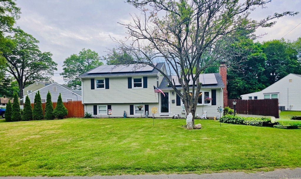 6 Pinecrest Dr, Plainville, CT 06062 - tri-level home with roof mounted solar panels and a chimney