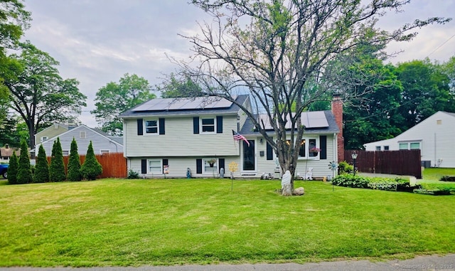 6 Pinecrest Dr, Plainville, CT 06062 - tri-level home with roof mounted solar panels and a chimney