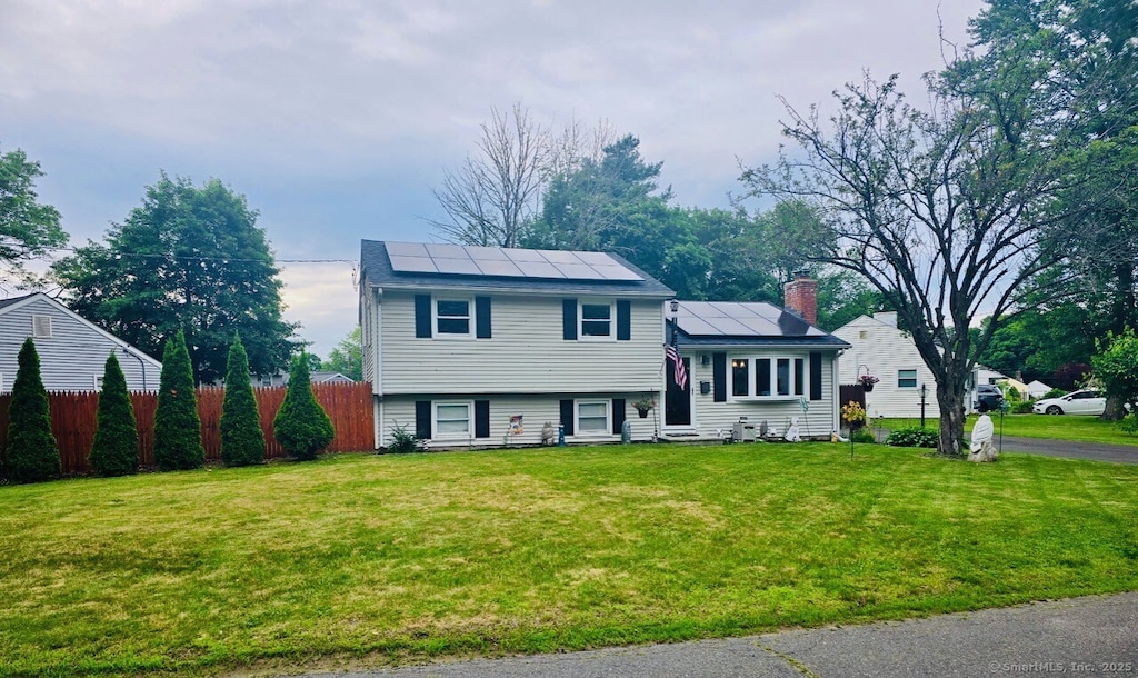 6 Pinecrest Dr, Plainville, CT 06062 - split level home featuring entry steps, solar panels, and a chimney