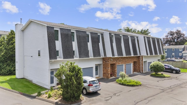 410 Farmington Ave Apt M2, New Britain, CT 06053 - view of front of home featuring a shingled roof, an attached garage, and driveway