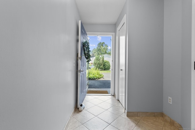 410 Farmington Ave Apt M2, New Britain, CT 06053 - doorway featuring light tile patterned flooring and baseboards