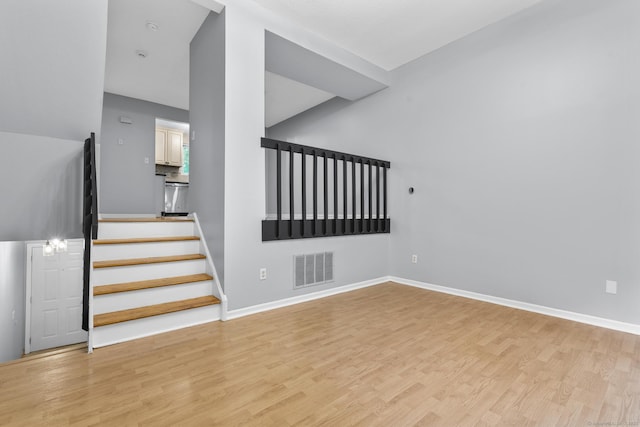 410 Farmington Ave Apt M2, New Britain, CT 06053 - stairs featuring wood finished floors and baseboards