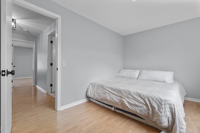 410 Farmington Ave Apt M2, New Britain, CT 06053 - bedroom with light wood-style floors and baseboards