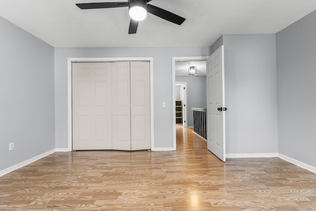 410 Farmington Ave Apt M2, New Britain, CT 06053 - unfurnished bedroom featuring light wood-style floors, a closet, and a ceiling fan