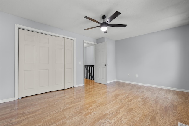 410 Farmington Ave Apt M2, New Britain, CT 06053 - unfurnished bedroom with light wood-style floors, a closet, and ceiling fan
