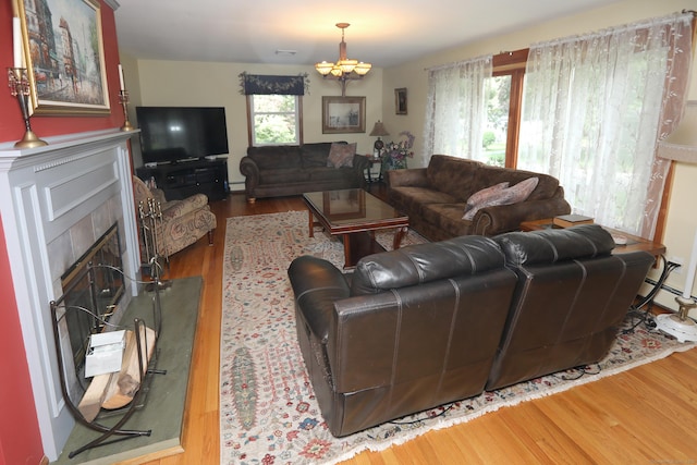 21 Berle Rd, South Windsor, CT 06074 - living room with wood finished floors, a fireplace, and baseboard heating