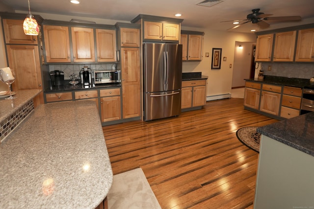 21 Berle Rd, South Windsor, CT 06074 - kitchen with appliances with stainless steel finishes, a baseboard heating unit, recessed lighting, backsplash, and a ceiling fan