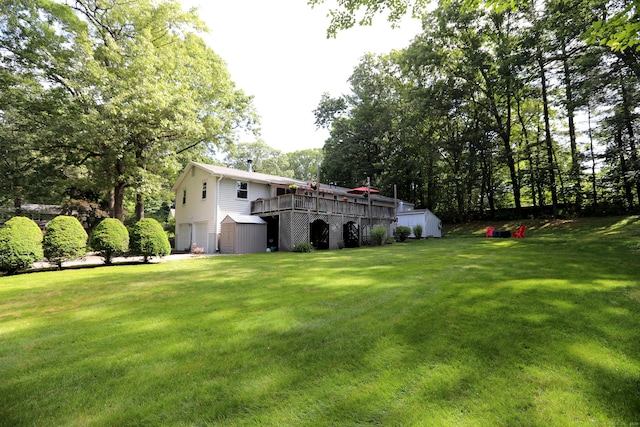 21 Berle Rd, South Windsor, CT 06074 - view of grassy yard with an attached garage and a deck