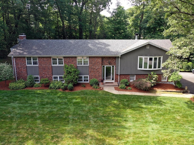 21 Berle Rd, South Windsor, CT 06074 - view of front of house with a chimney, a front lawn, brick siding, and a shingled roof