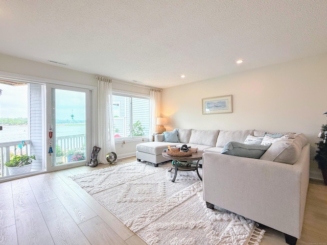 5 Mansfield Grove Rd Apt 146, East Haven, CT 06512 - living area featuring wood finished floors, a textured ceiling, and recessed lighting