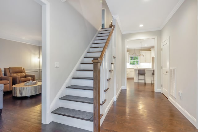 13 Spruce Ridge Dr, New Fairfield, CT 06812 - stairs featuring ornamental molding, wood finished floors, and recessed lighting