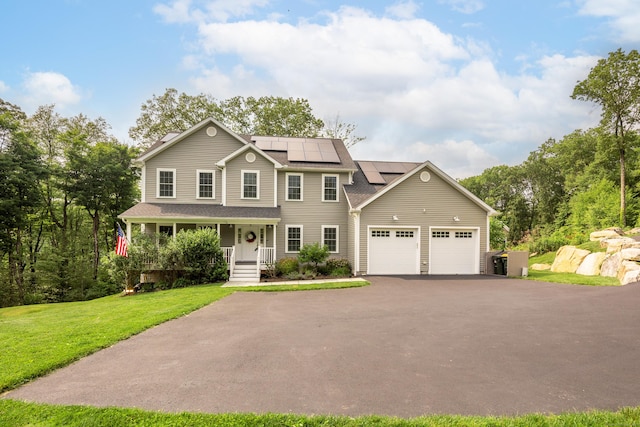 13 Spruce Ridge Dr, New Fairfield, CT 06812 - view of front of property with covered porch, asphalt driveway, an attached garage, a front lawn, and solar panels