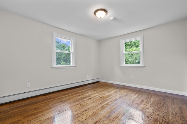 14 Pine Tree Ln, Avon, CT 06001 - unfurnished room with baseboard heating and wood finished floors
