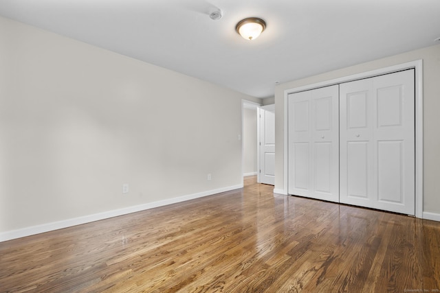 14 Pine Tree Ln, Avon, CT 06001 - unfurnished bedroom featuring wood finished floors and a closet