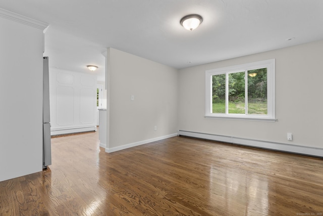 14 Pine Tree Ln, Avon, CT 06001 - spare room featuring a baseboard radiator, wood finished floors, and baseboard heating