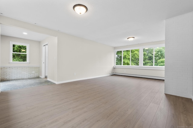 14 Pine Tree Ln, Avon, CT 06001 - unfurnished room featuring a baseboard heating unit and wood finished floors