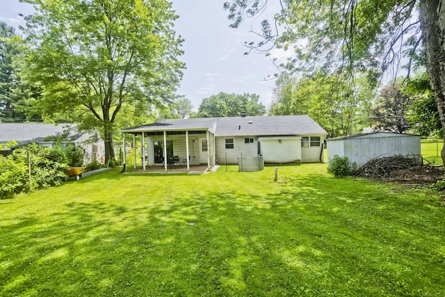 6 Weymouth Dr, Enfield, CT 06082 - rear view of property with a patio area and a lawn