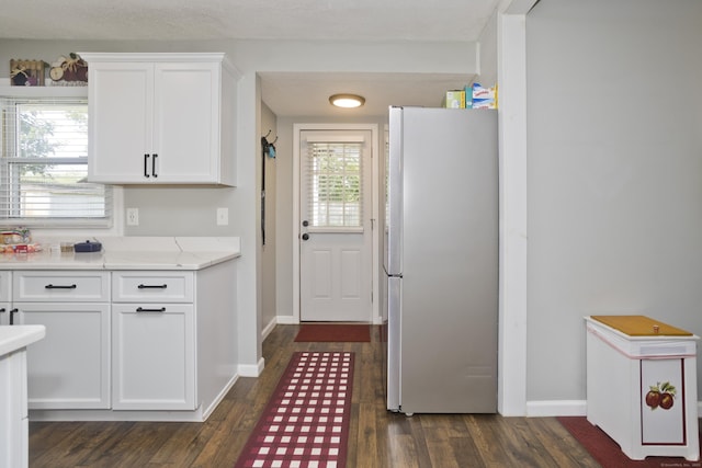 6 Weymouth Dr, Enfield, CT 06082 - kitchen with freestanding refrigerator, white cabinets, and dark wood finished floors