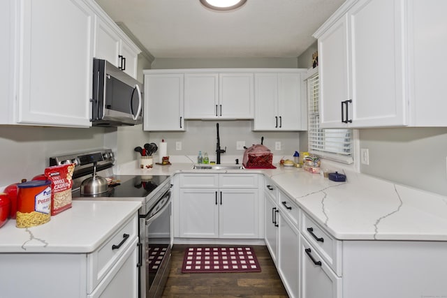6 Weymouth Dr, Enfield, CT 06082 - kitchen featuring stainless steel appliances, white cabinets, dark wood-style floors, and light stone countertops