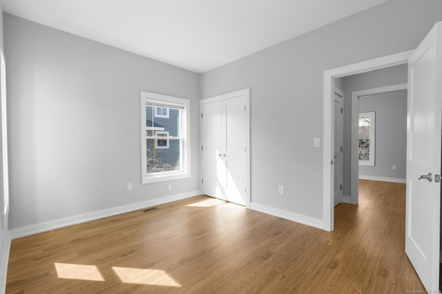 195 Arctic St, Bridgeport, CT 06608 - unfurnished bedroom featuring wood finished floors and a closet