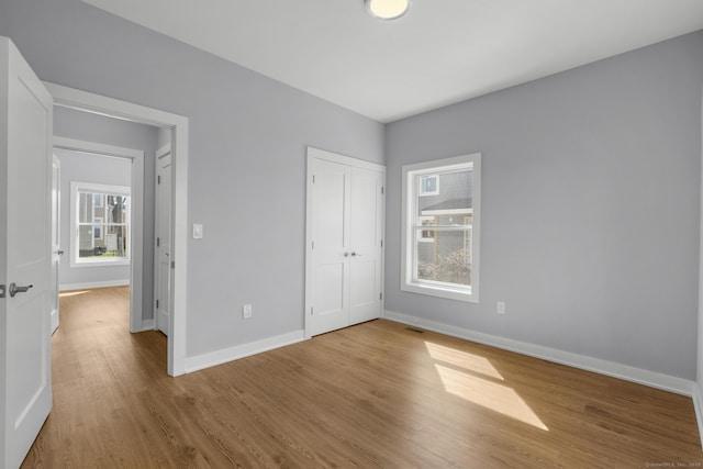 195 Arctic St, Bridgeport, CT 06608 - unfurnished bedroom with wood finished floors and a closet
