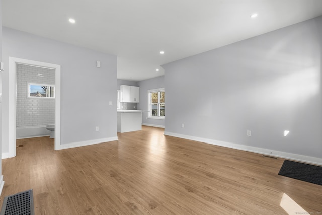 195 Arctic St, Bridgeport, CT 06608 - unfurnished living room featuring light wood-style flooring