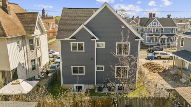 195 Arctic St, Bridgeport, CT 06608 - rear view of property with roof with shingles