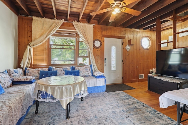 283 Third Ave, West Haven, CT 06516 - living room with wood finished floors, wooden walls, ceiling fan, and a wood ceiling with exposed beams