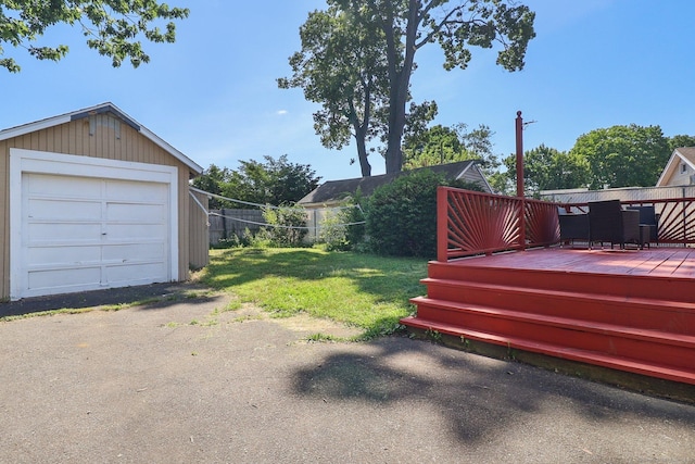 283 Third Ave, West Haven, CT 06516 - view of green lawn featuring a deck, a garage, and an outbuilding