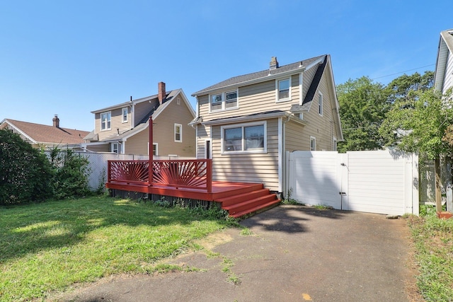 283 Third Ave, West Haven, CT 06516 - rear view of house with a gate, a deck, and a chimney