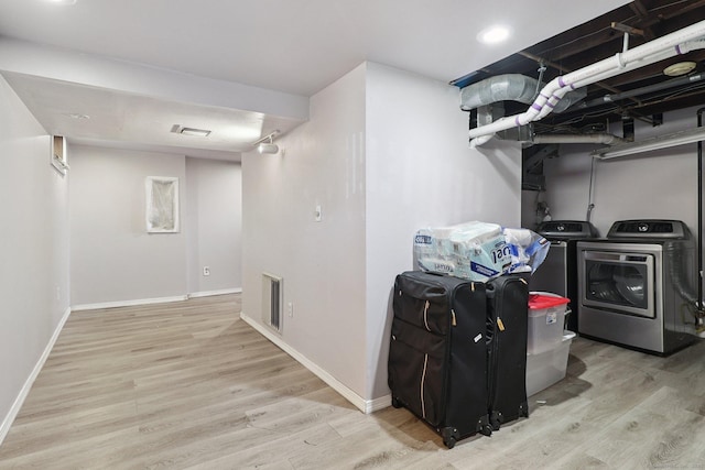 283 Third Ave, West Haven, CT 06516 - laundry area featuring independent washer and dryer and wood finished floors