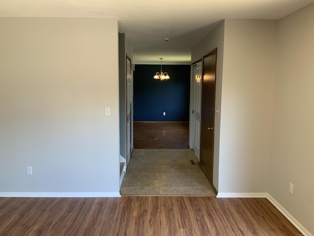 158 Webster Ct Unit 158, Newington, CT 06111 - corridor featuring a chandelier and wood finished floors
