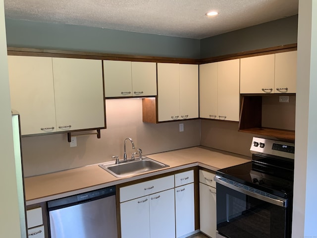 158 Webster Ct Unit 158, Newington, CT 06111 - kitchen with appliances with stainless steel finishes, white cabinetry, light countertops, a textured ceiling, and recessed lighting