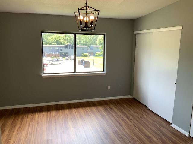 158 Webster Ct Unit 158, Newington, CT 06111 - empty room with a chandelier and dark wood-style flooring