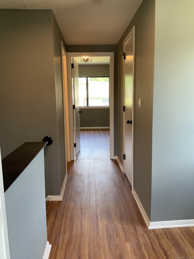 158 Webster Ct Unit 158, Newington, CT 06111 - corridor with dark wood-type flooring and a chandelier