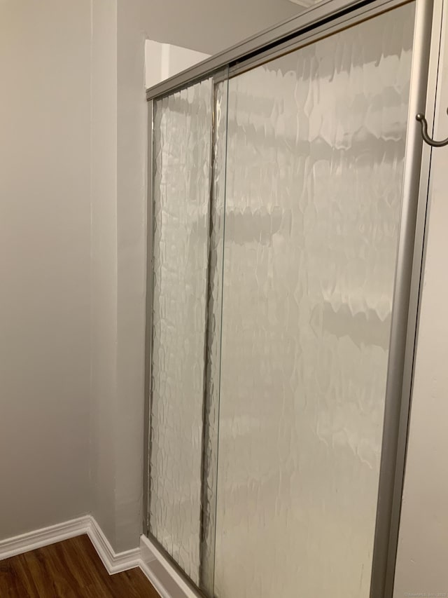 158 Webster Ct Unit 158, Newington, CT 06111 - bathroom featuring wood finished floors and an enclosed shower