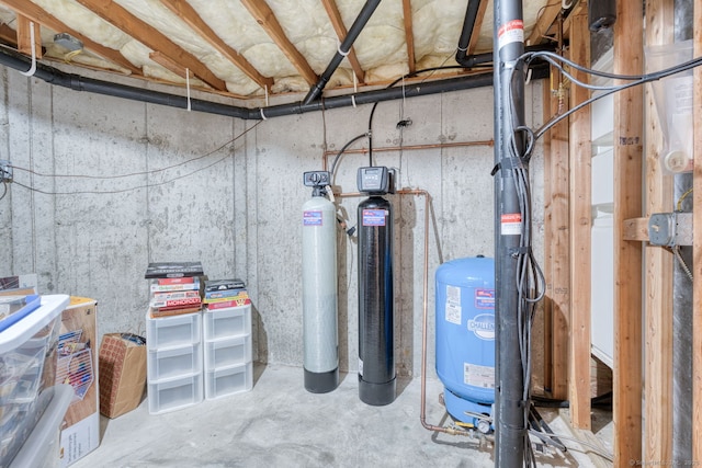 1047 Merrow Rd, Coventry, CT 06238 - unfinished basement with a water softener system and a water pressure tank