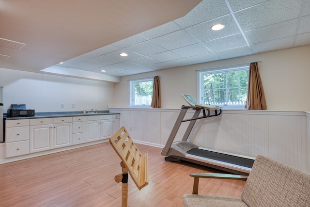 1047 Merrow Rd, Coventry, CT 06238 - workout area with a wainscoted wall, light wood-style flooring, a drop ceiling, and recessed lighting