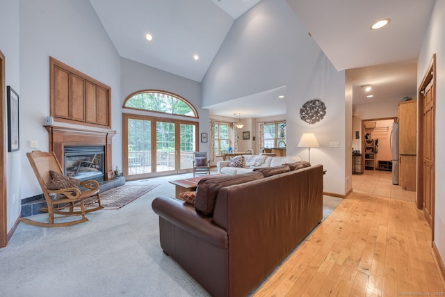 1047 Merrow Rd, Coventry, CT 06238 - living area with high vaulted ceiling, a glass covered fireplace, and recessed lighting