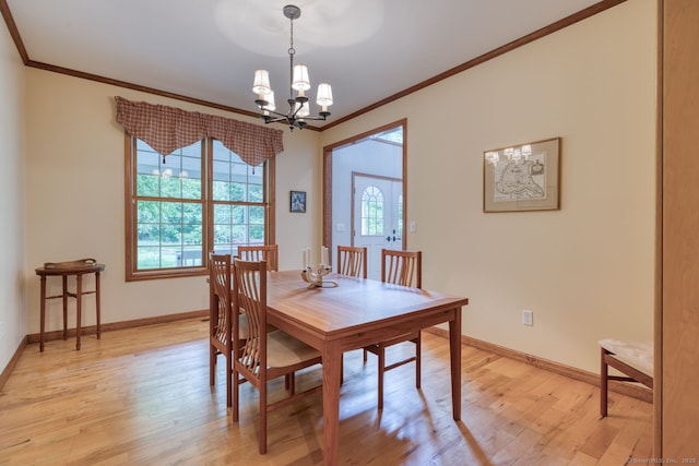 1047 Merrow Rd, Coventry, CT 06238 - dining area with a chandelier, crown molding, and light wood-style flooring
