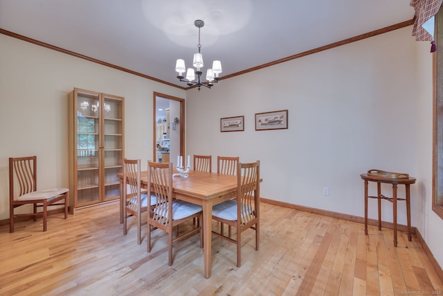 1047 Merrow Rd, Coventry, CT 06238 - dining space featuring a chandelier, light wood-style floors, and crown molding