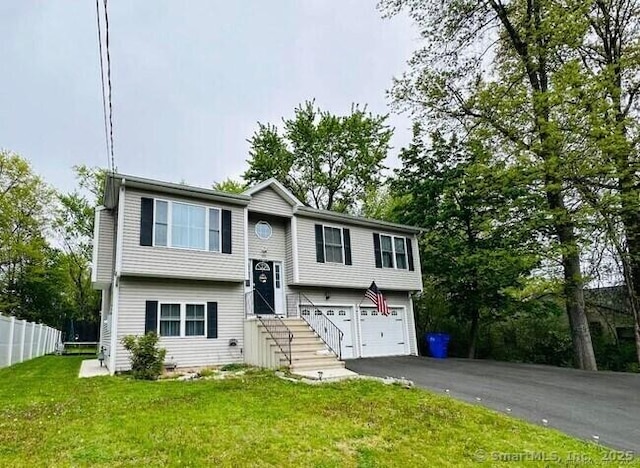 470 Nott St, Wethersfield, CT 06109 - bi-level home featuring an attached garage and asphalt driveway
