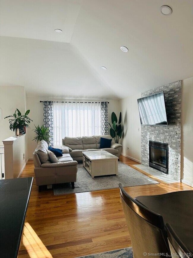 470 Nott St, Wethersfield, CT 06109 - living area featuring wood finished floors, a fireplace, and lofted ceiling