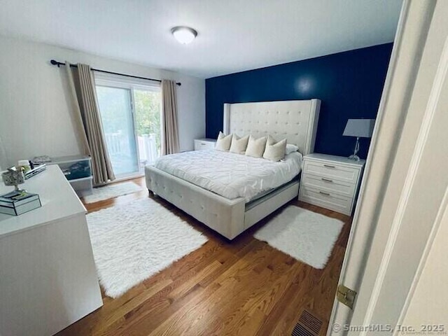 470 Nott St, Wethersfield, CT 06109 - bedroom featuring wood finished floors and access to outside