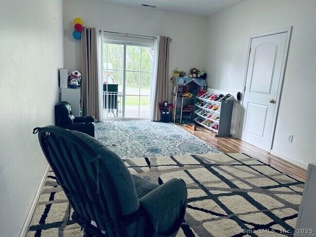 470 Nott St, Wethersfield, CT 06109 - bedroom featuring access to exterior and wood finished floors